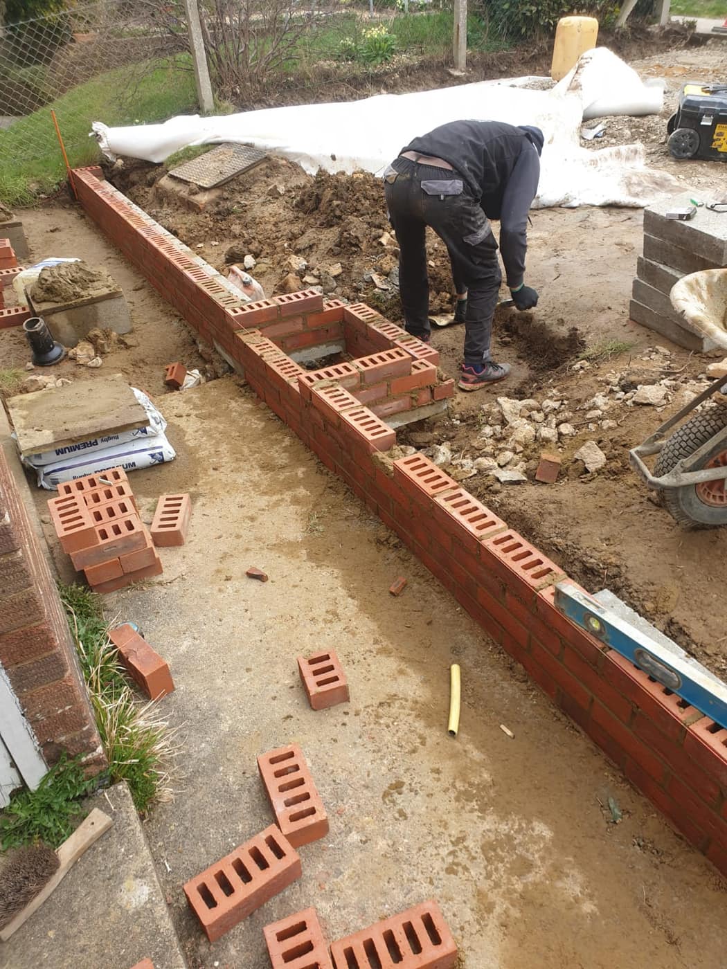 Brick retaining wall and steps under construction
