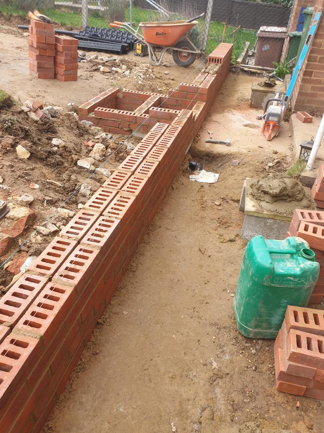 Brick retaining wall and steps under construction
