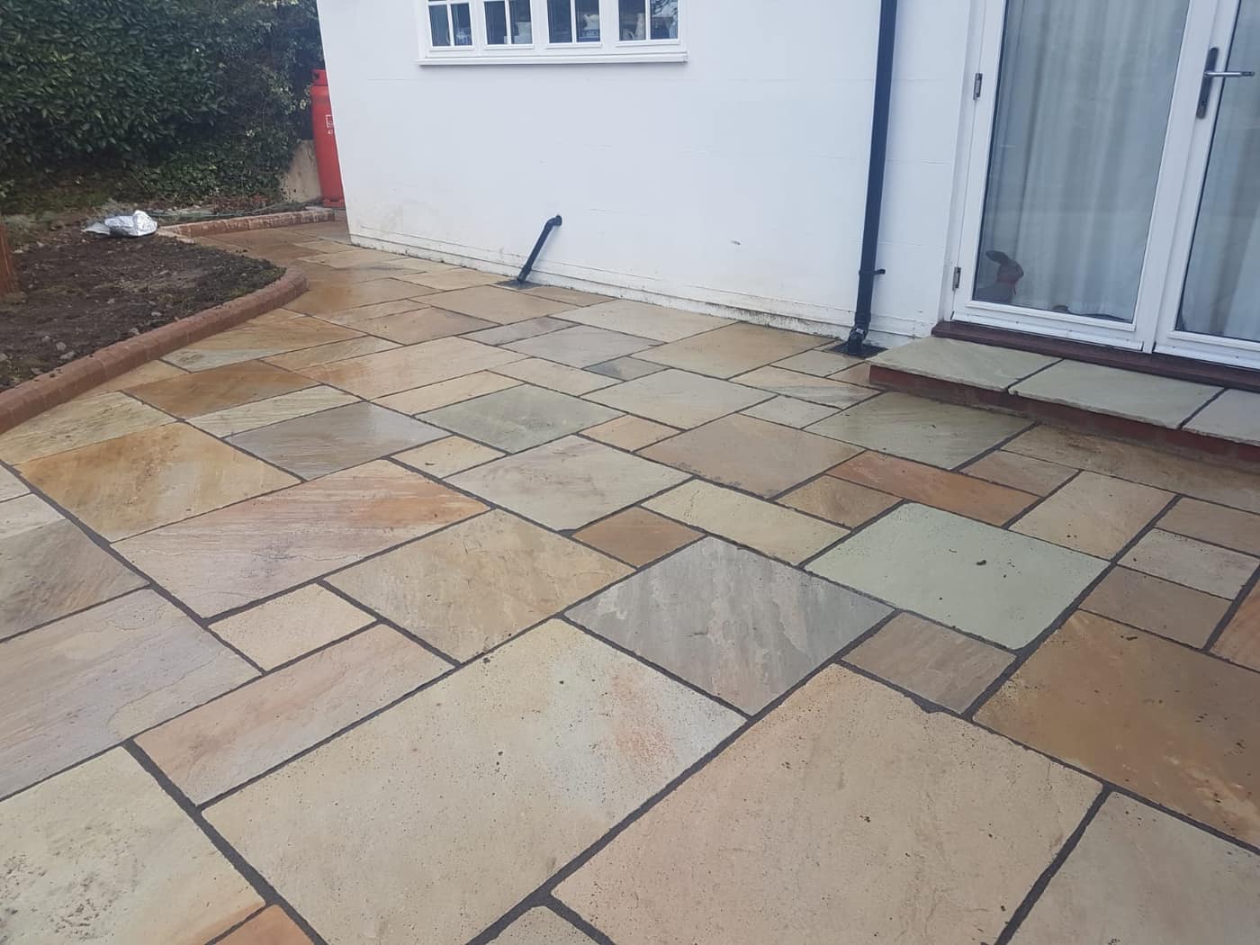 Sandstone patio laid by South East Groundworks