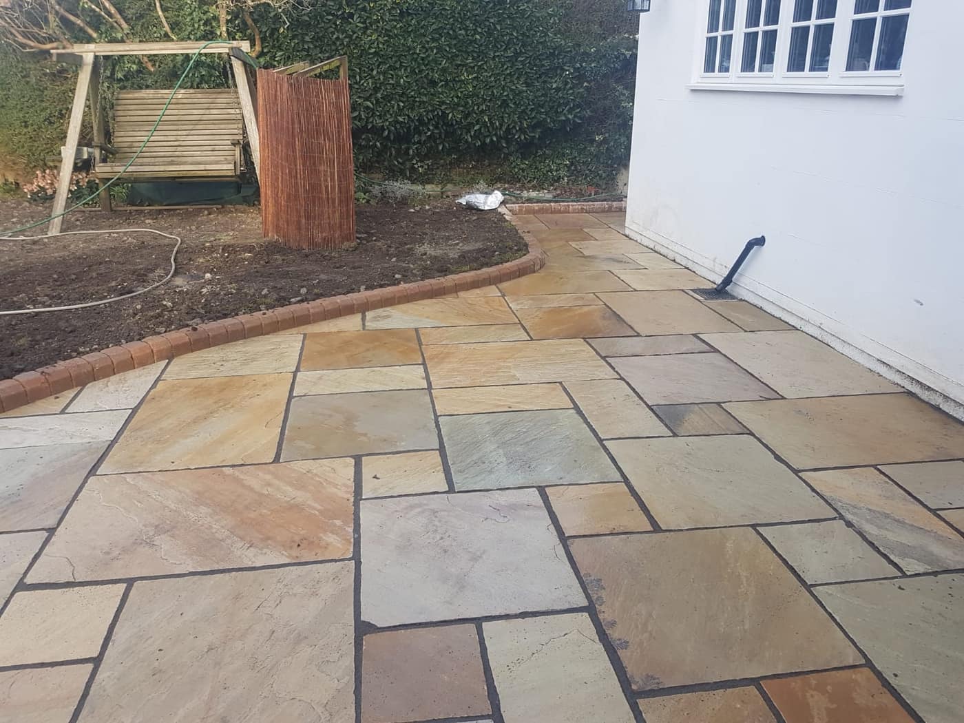 Sandstone patio laid by South East Groundworks