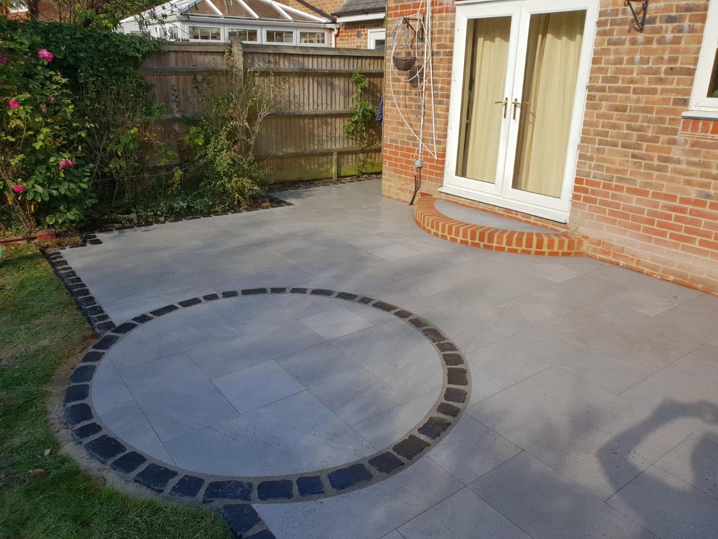 Grey porcelain patio laid by South East Groundworks